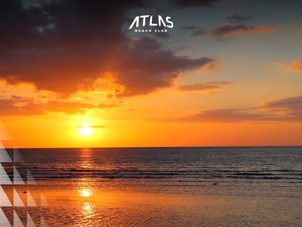 Volcanic black sand, calm Lovina Beach, peaceful sunbathing